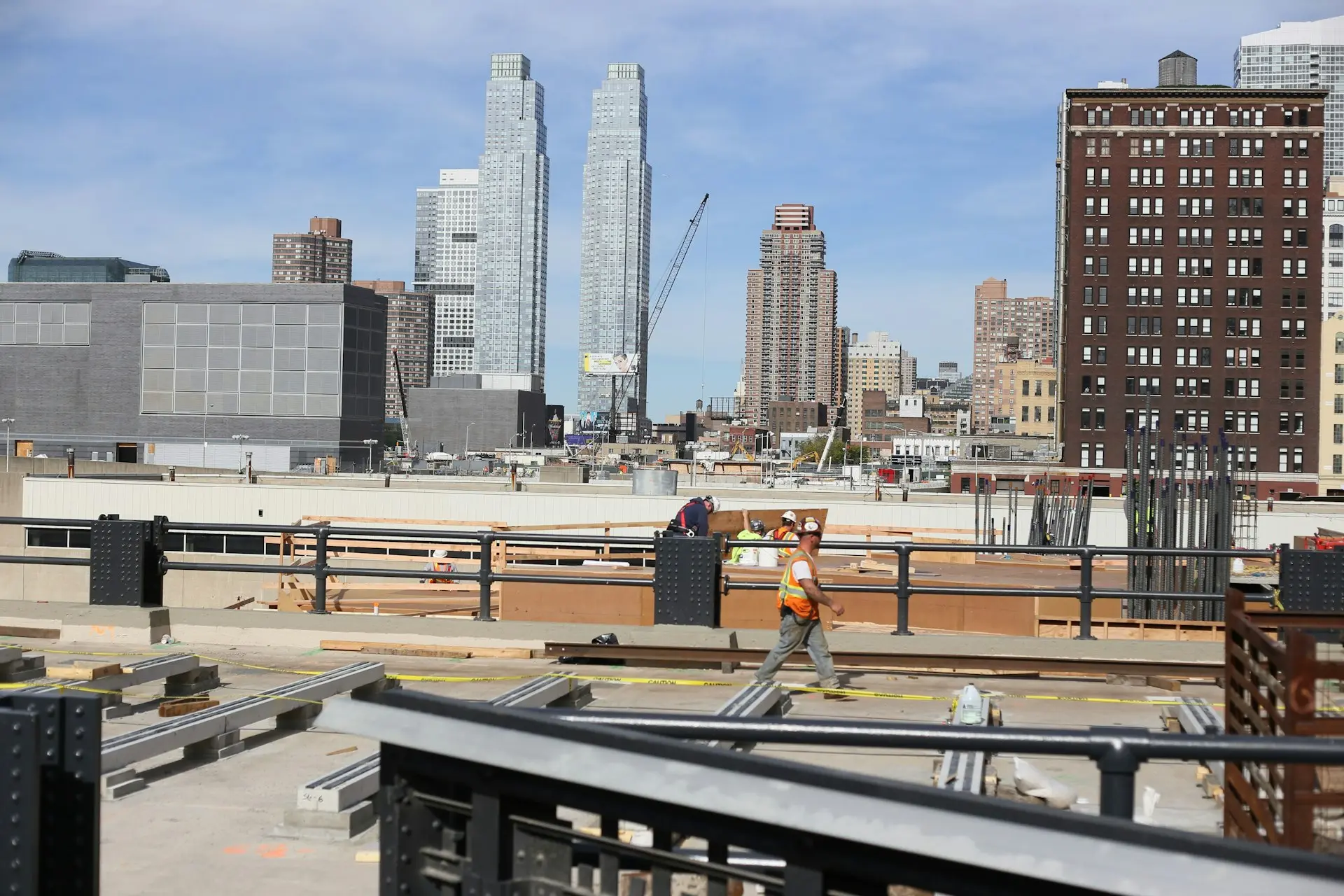 a construction worker standing on top of a roof
